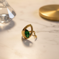 Emerald Teardrop Frame Ring – Elegant Background