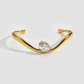 Gold Twisted Cuff Bracelet with Pear Crystal Solitaire